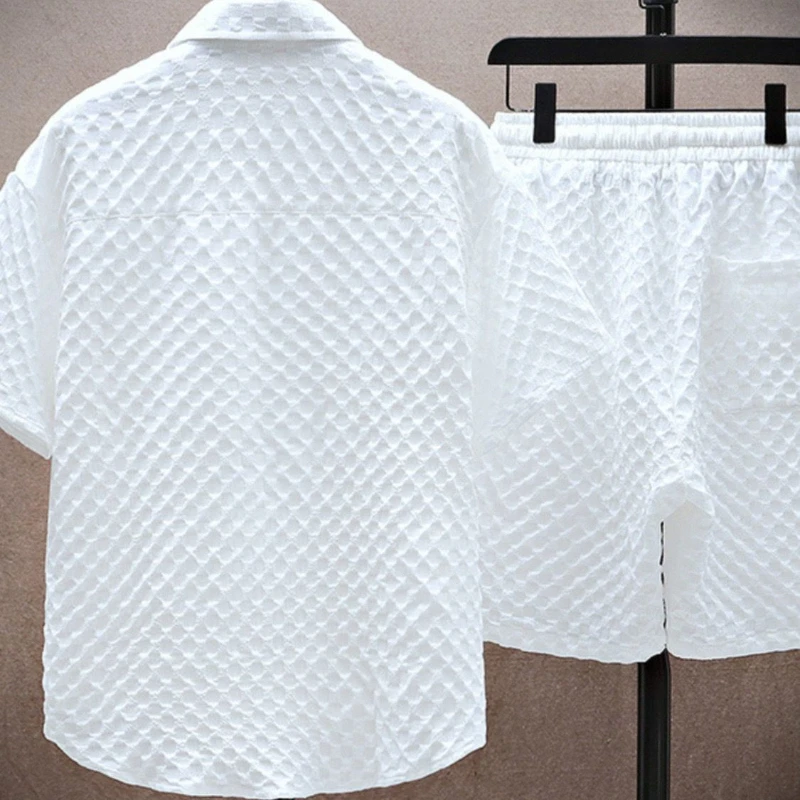 Coordinated men's summer two-piece outfit with relaxed fit. Breathable waffle texture, perfect for warm weather.