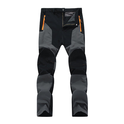 Insulated men's waterproof work pants, ideal for winter and all-weather outdoor jobs, offering warmth and durability.