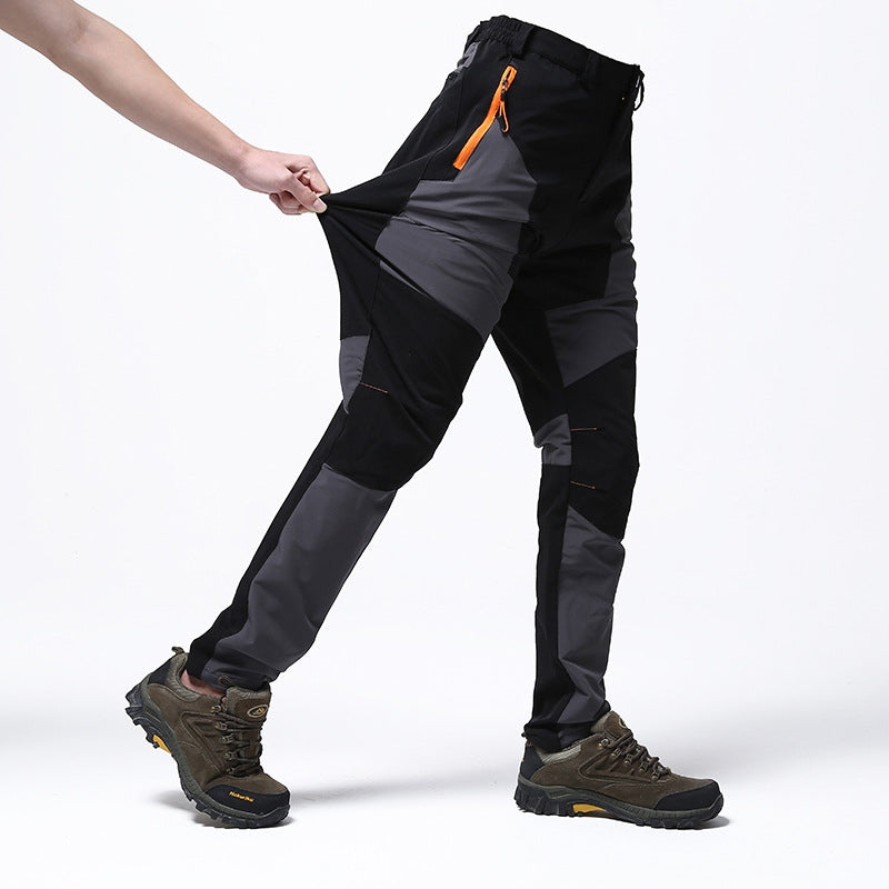 Durable men's outdoor work pants with reinforced knees, waterproof for heavy-duty tasks and all-weather protection.