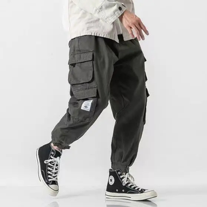 Men's tapered fit utility pants, heavyweight cotton, cargo pockets, versatile casual wear.