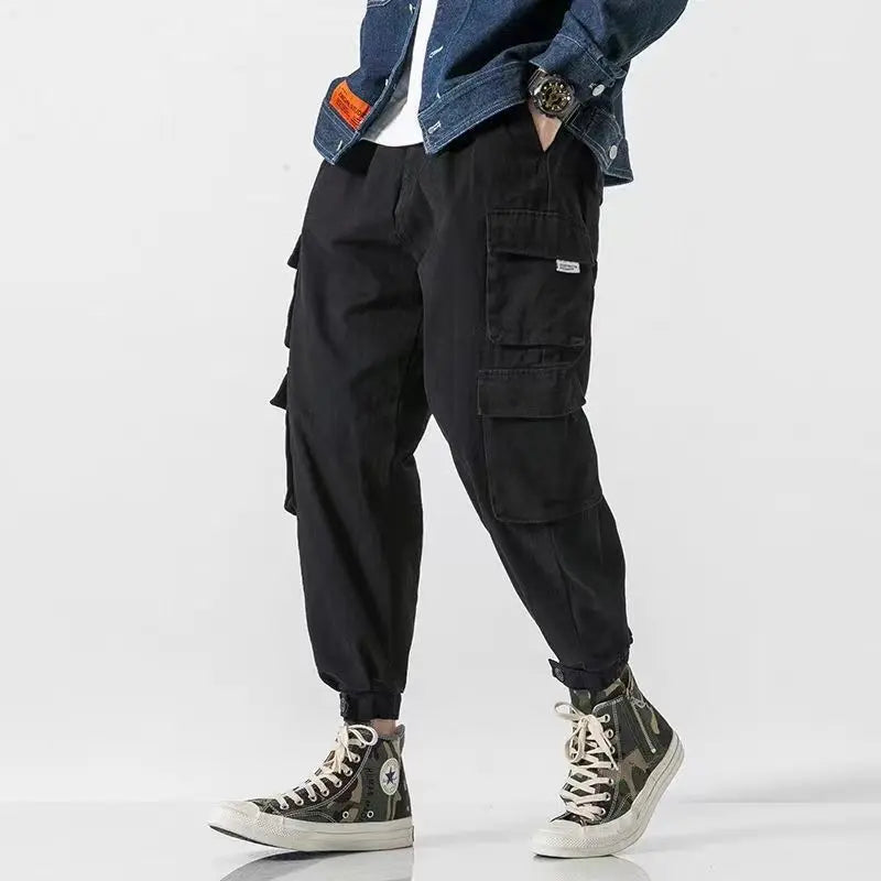 Men's athletic cargo joggers, heavyweight cotton, practical utility pockets, sleek tapered design.