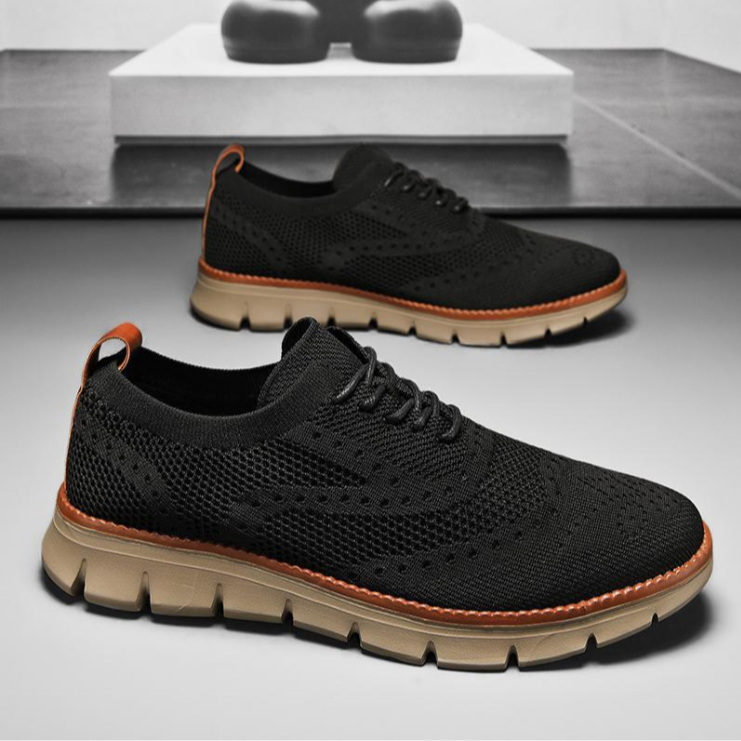 Black men's heritage brogue dress sneakers. Orthopedic support, odor control, sleek design for comfort.