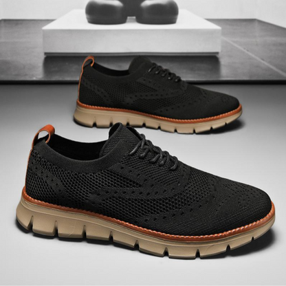 Black men's heritage brogue dress sneakers. Orthopedic support, odor control, sleek design for comfort.