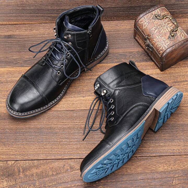 Close-up of Men's Heritage Classic boots showing quality leather, lace detail, and convenient side zipper.
