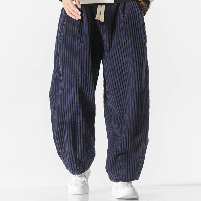 Comfortable men's wide-leg joggers with a heritage design. Relaxed fit casual pants for modern leisure and everyday style.