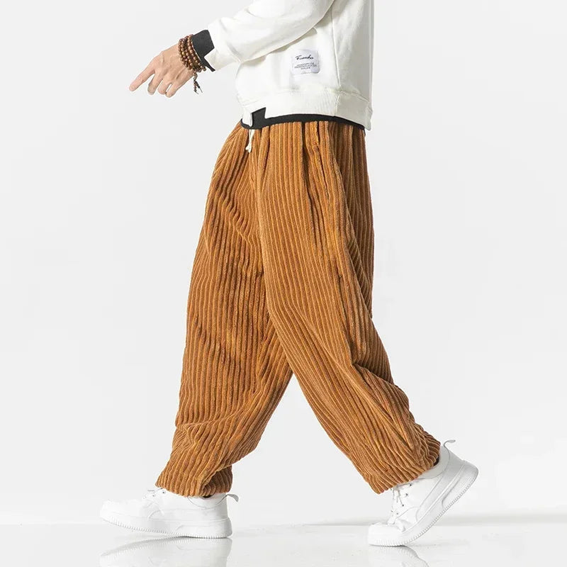Relaxed fit men's wide-leg jogger pants with an adjustable drawstring for ultimate comfort. Versatile casual everyday wear.