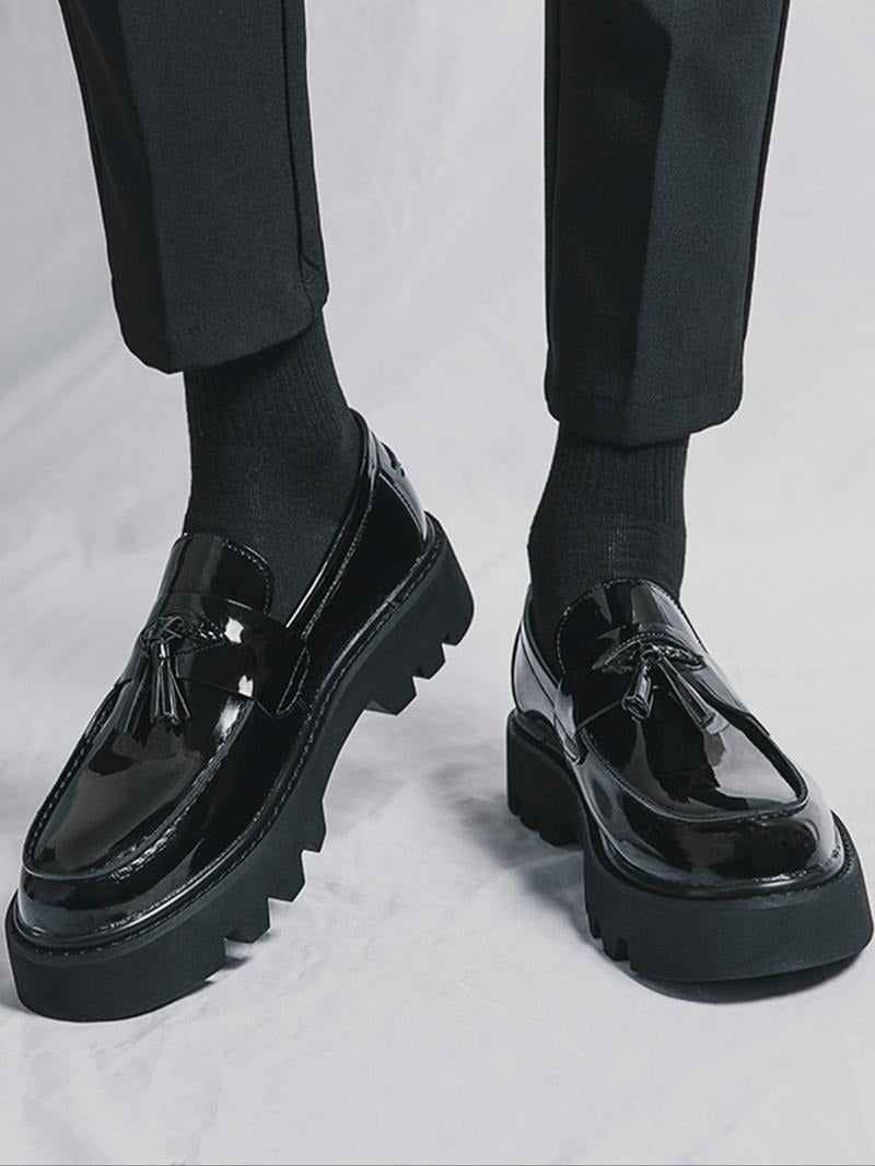 Classic men's black tassel loafers with a trendy chunky sole, ideal as comfortable dress shoes & formal footwear.