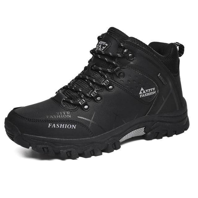 High-angle shot of men's durable high-top hiking boots, essential outdoor footwear for trekking.