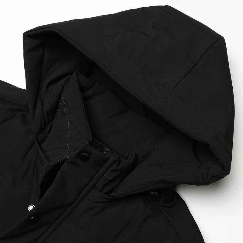 Close-up of men's weather-resistant winter coat fabric. Insulated and durable, designed for cold conditions.