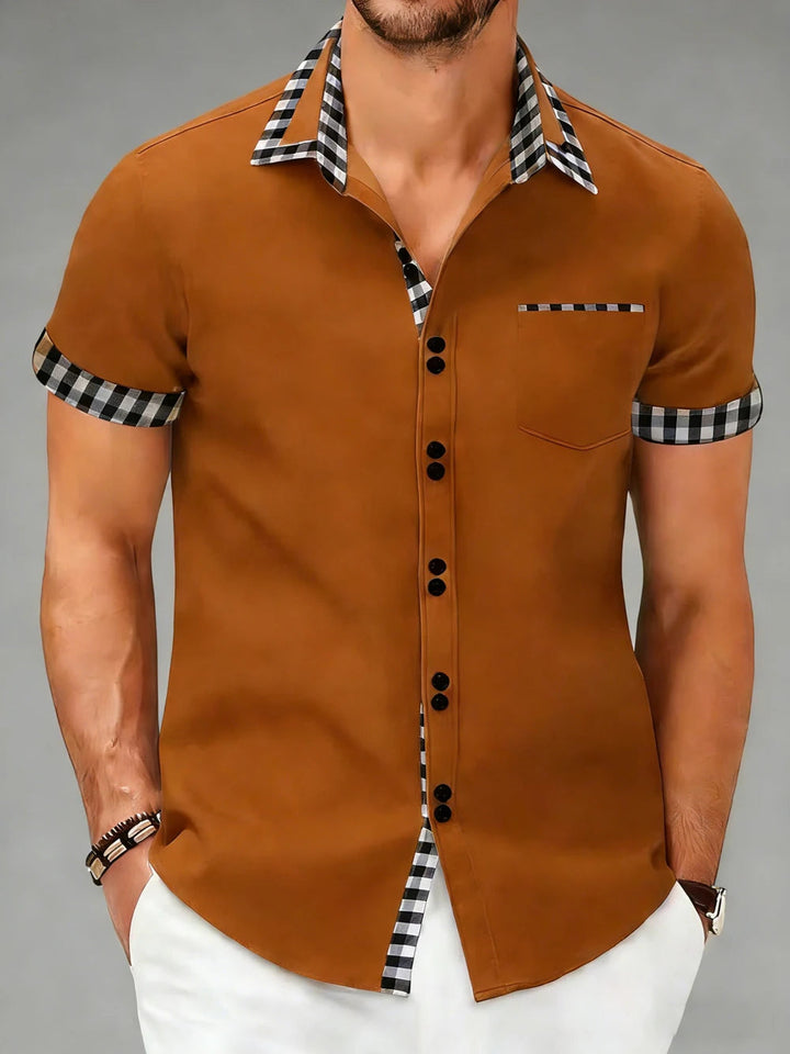Close-up of Hudson men's checkered shirt fabric. Tailored fit, button-up, long sleeve for fashion.