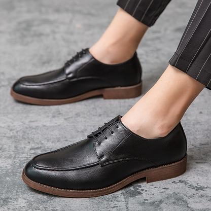 High-quality smooth brown leather texture of Men's Hudson polished lace-up dress shoes, classic formal footwear.
