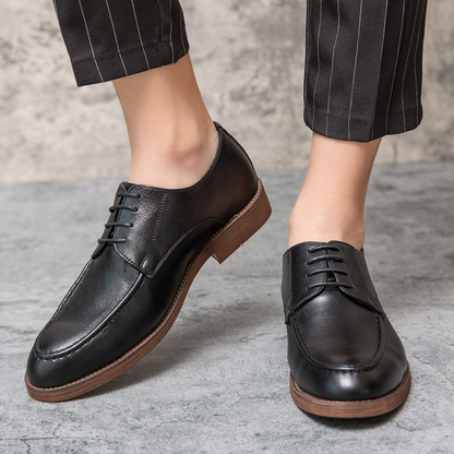Glossy shine on Men's Hudson brown polished leather lace-up dress shoes, luxurious formal & business footwear.