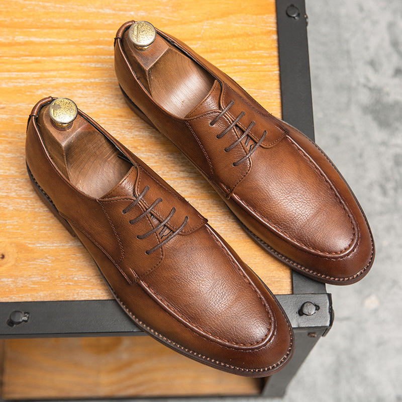 Shining polished finish on Men's Hudson brown leather lace-up dress shoes, essential for elegant business footwear.