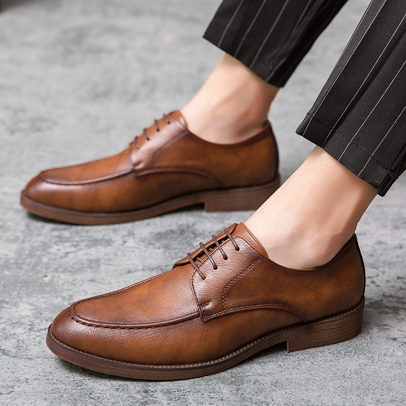Front view of Men's Hudson black polished formal shoes, classic lace-up style for professional business attire.