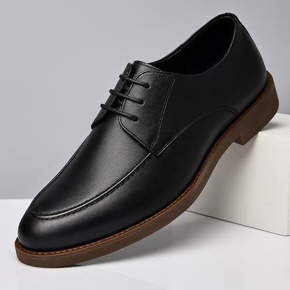 Top-down perspective of Men's Hudson black polished dress shoes, sleek lace-up style for professional men's footwear.