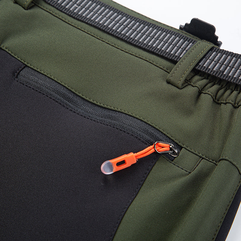 Front view of men's insulated cold-weather pants, durable winterwear for outdoor gear.