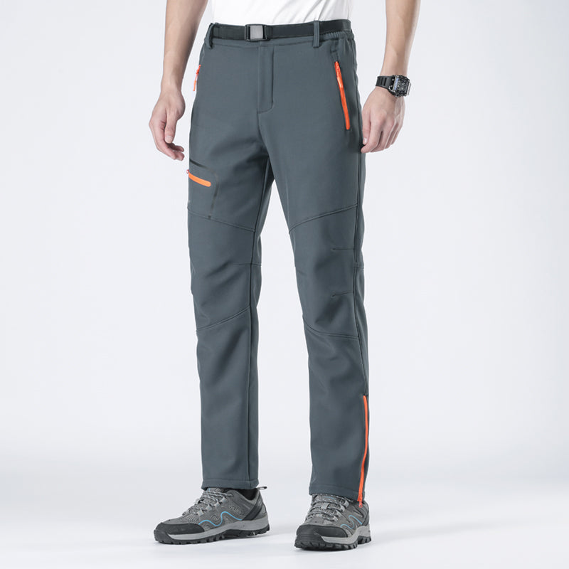 Men's adventure pants, insulated & wind-resistant for active cold weather outdoor use.