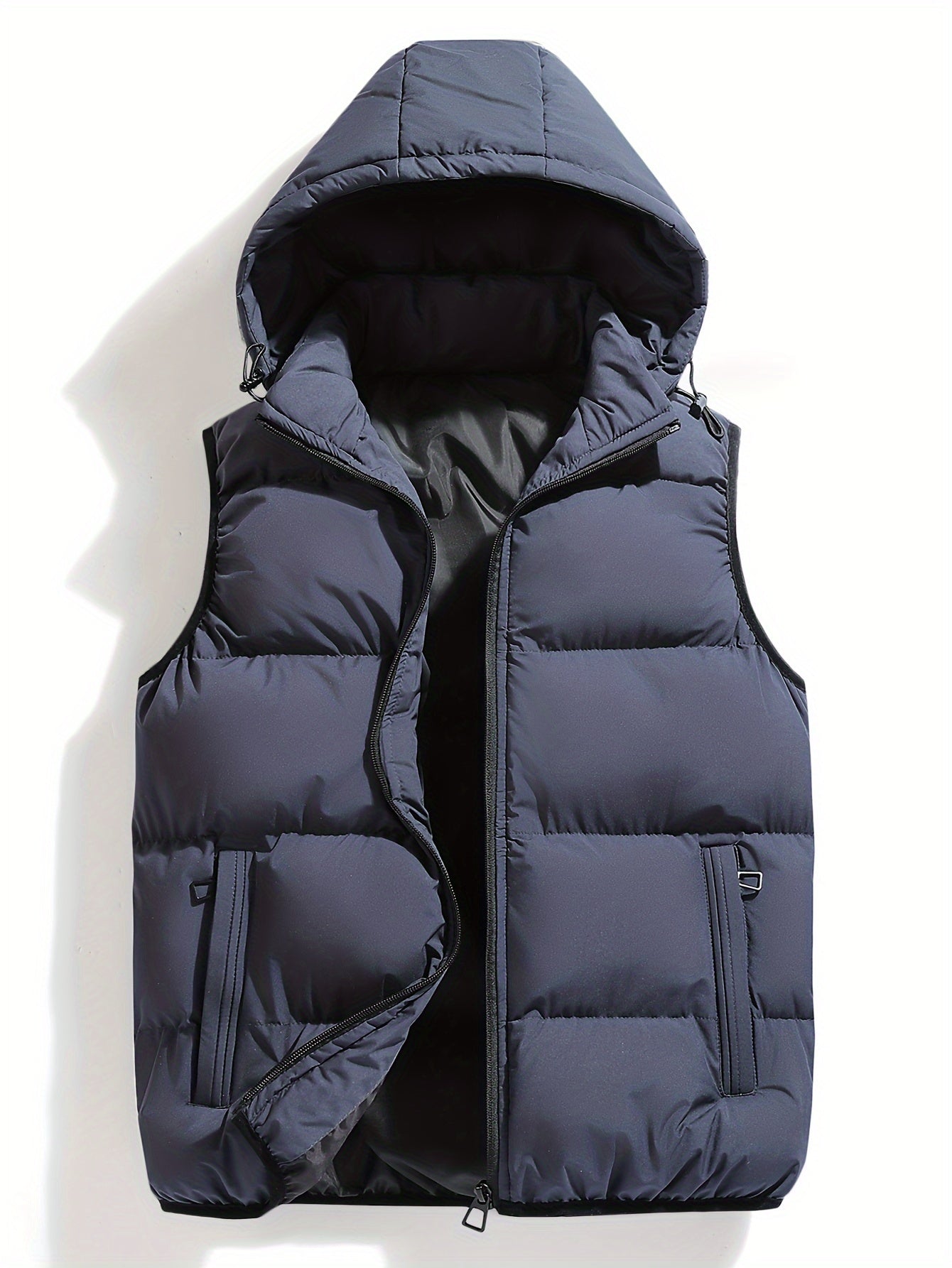 Warm men's insulated puffer vest with hood. Weather-resistant outerwear, lightweight for active winter layering.