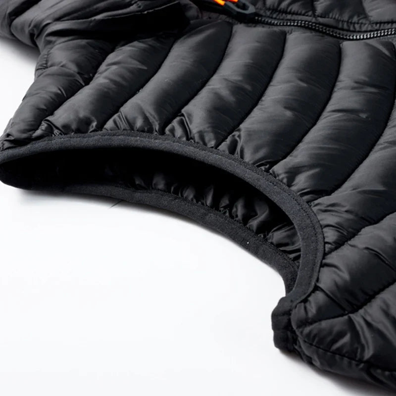 Men's insulated cold weather vest, water-resistant with a detachable hood, perfect for layering and outdoor protection.