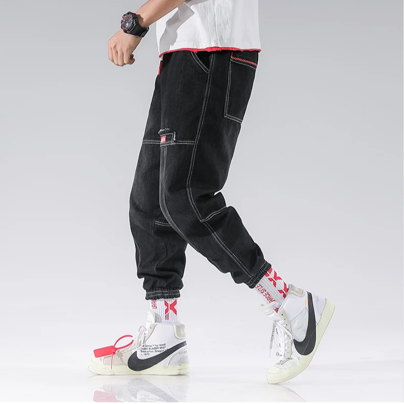 Close-up of comfortable, anti-fade denim fabric on Men's Jacques Tapered Joggers, machine washable.