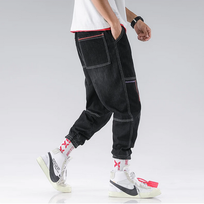 Side view of men's Jacques Tapered Denim Joggers, showcasing modern tapered leg and relaxed fit.