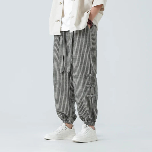 Men's Japanese streetwear pants with side stripe, loose fit, and comfortable urban style.
