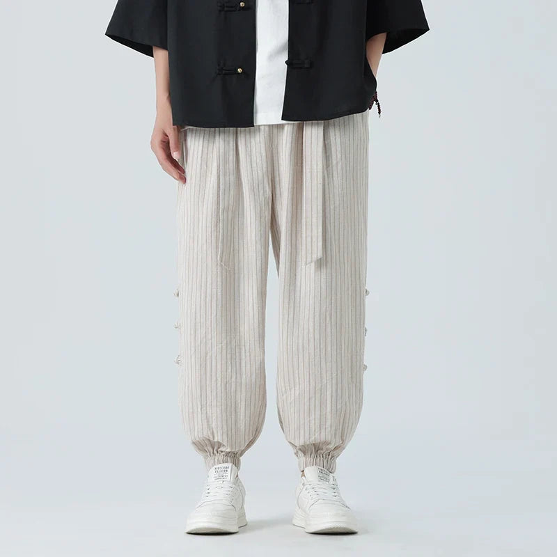 Comfortable men's loose-fit side stripe pants, perfect for casual Japanese streetwear style.