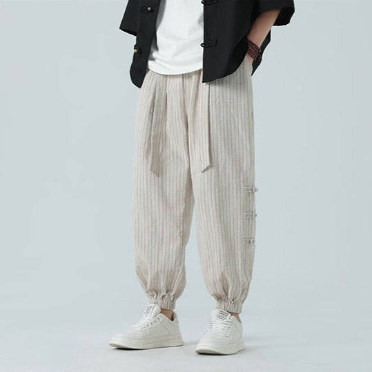 Beige men's casual pants, side stripe design, bringing modern Japanese urban aesthetics.