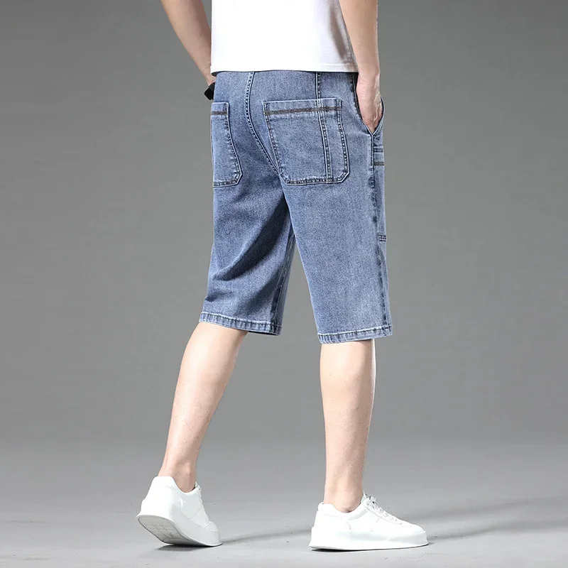 Dark blue men's utility denim shorts with practical multi-pockets, durable for everyday comfort.