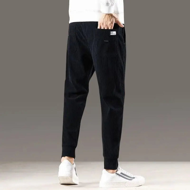 Man wearing Kaizen Jogger Pants in a relaxed pose. Soft, comfortable, and versatile for any activity.