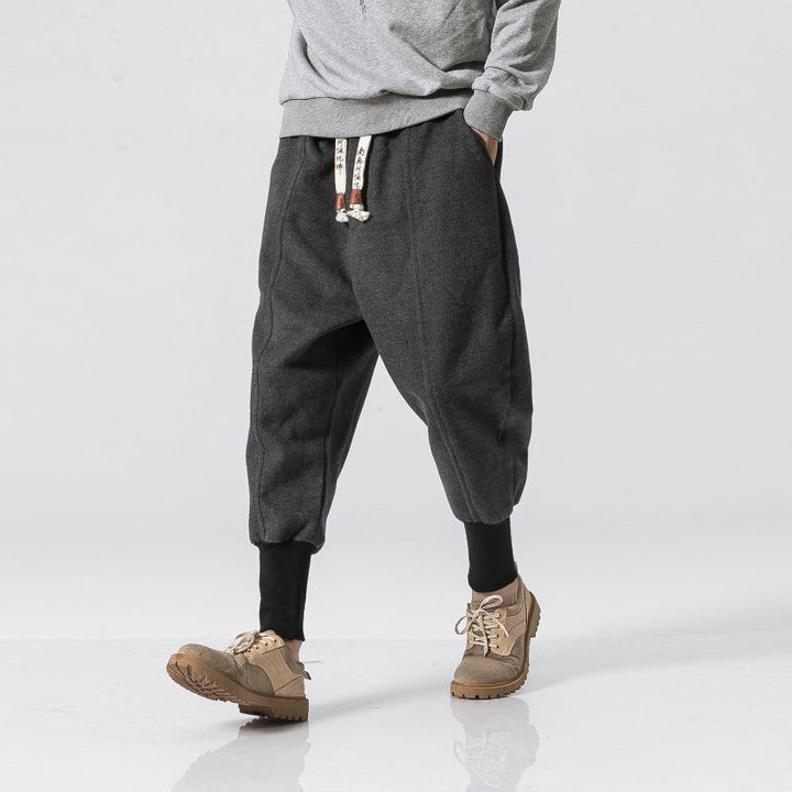 Stylish men's Katana relaxed fit tapered black pants with drop crotch, perfect for streetwear & loungewear.