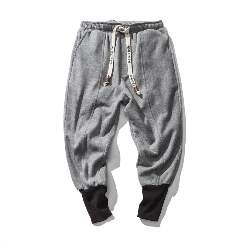 Men's Katana relaxed fit tapered black pants, featuring a comfortable drop crotch and modern stylish design.