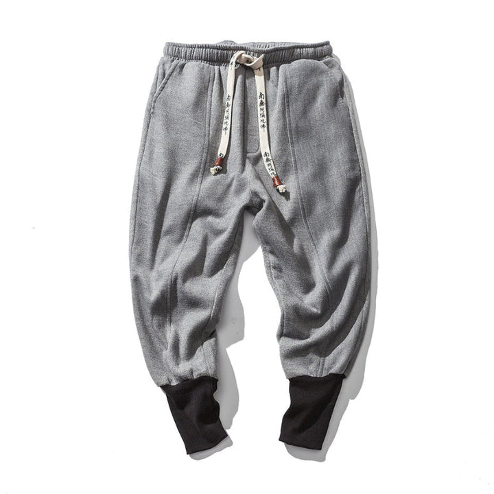 Men's Katana relaxed fit tapered black pants, featuring a comfortable drop crotch and modern stylish design.
