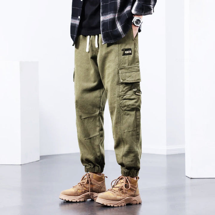 Durable green Kellan men's cargo pants, ideal for casual wear, workwear & outdoor activities.
