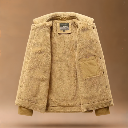 Navy blue men's sherpa-lined trucker jacket, stylish cotton blend for cold weather.
