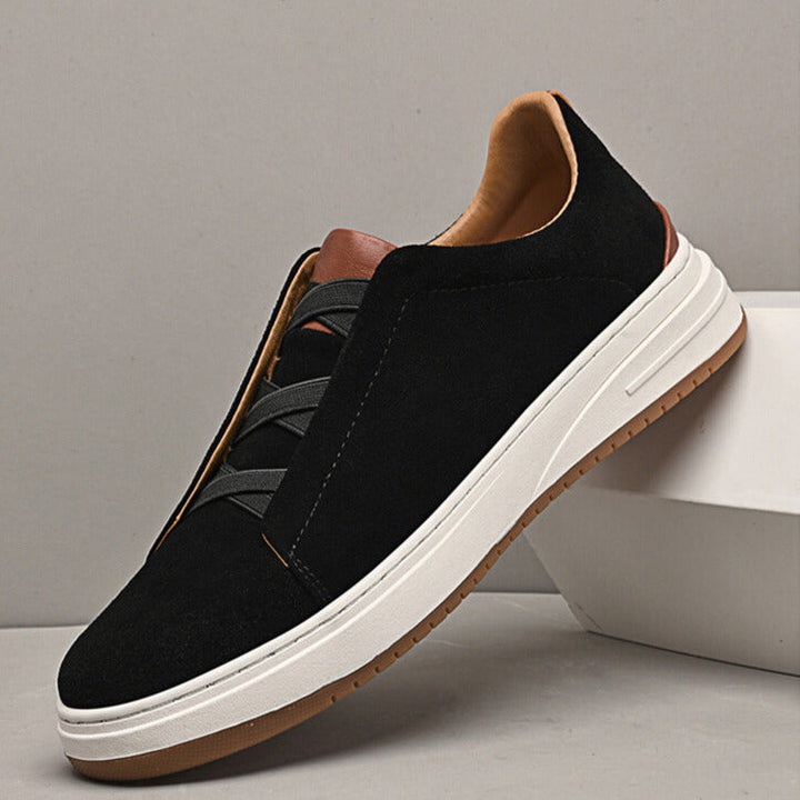 Black slip-on sneakers for men, refined & versatile everyday footwear.