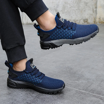 Breathable KinetiQ sport shoes for men, engineered for lightweight active performance and versatility.
