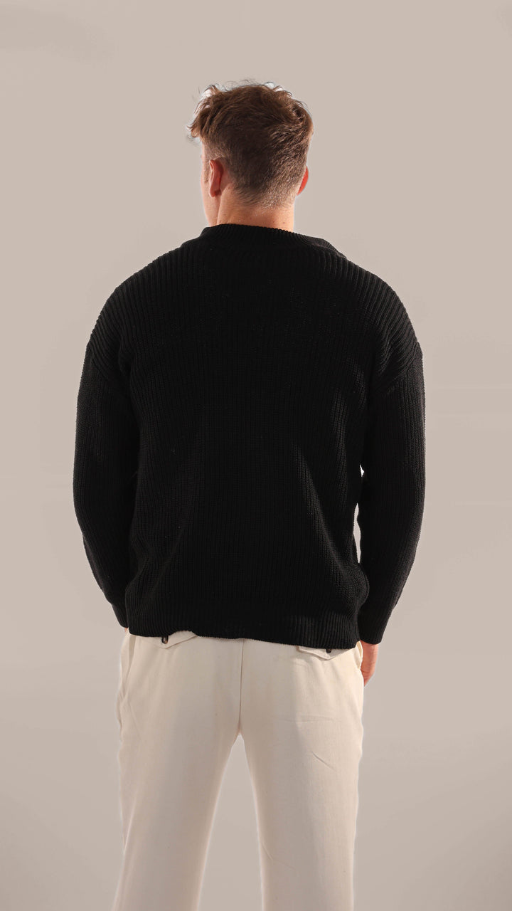Close-up of the soft knitted texture on a men's half-zip jumper, highlighting quality and comfort for everyday wear.