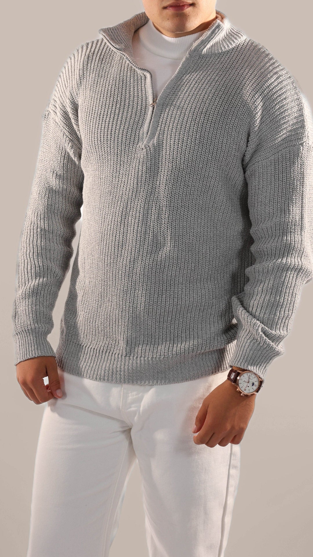 Man in a stylish knitted half-zip jumper, ideal for versatile autumn fashion, offering smart casual comfort and warmth.