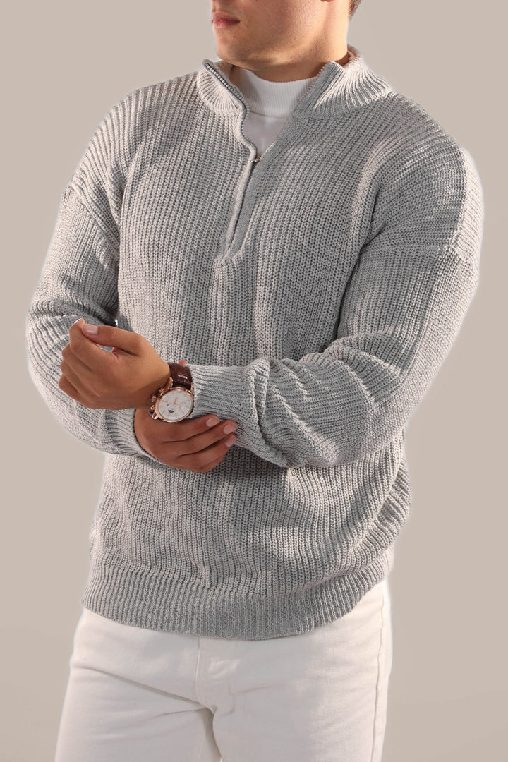 Detail of the stand collar and half-zip on a men's versatile knitted jumper, emphasizing its smart casual appeal.