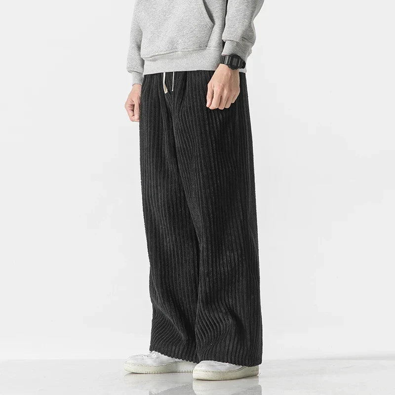 Modern men's straight-leg pants with a relaxed fit, offering minimalist style & ultimate comfort.