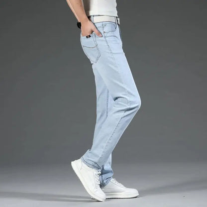 Man in Langford Classic Stretch Denim Jeans, showcasing comfortable men's straight leg blue denim for casual style.