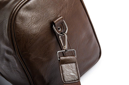 Rugged men's leather travel duffel, durable and lightweight carry-on for any trip.