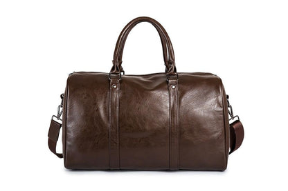 Close-up of comfortable leather strap on men's travel duffel, a lightweight carry-on.