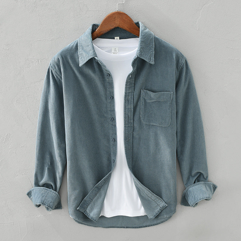 Stylish dark blue long-sleeve men's shirt with button-up front and chest pocket, ideal for casual fashion.