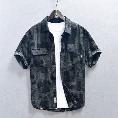 Black men's lightweight denim shirt. Casual double pocket design for effortless summer comfort & style.