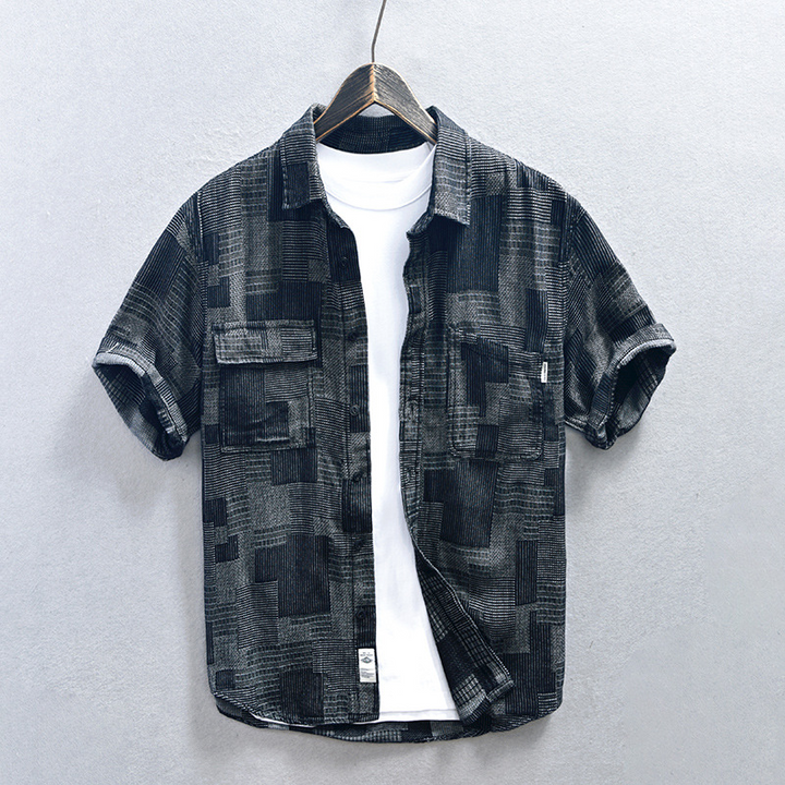 Black men's lightweight denim shirt. Casual double pocket design for effortless summer comfort & style.