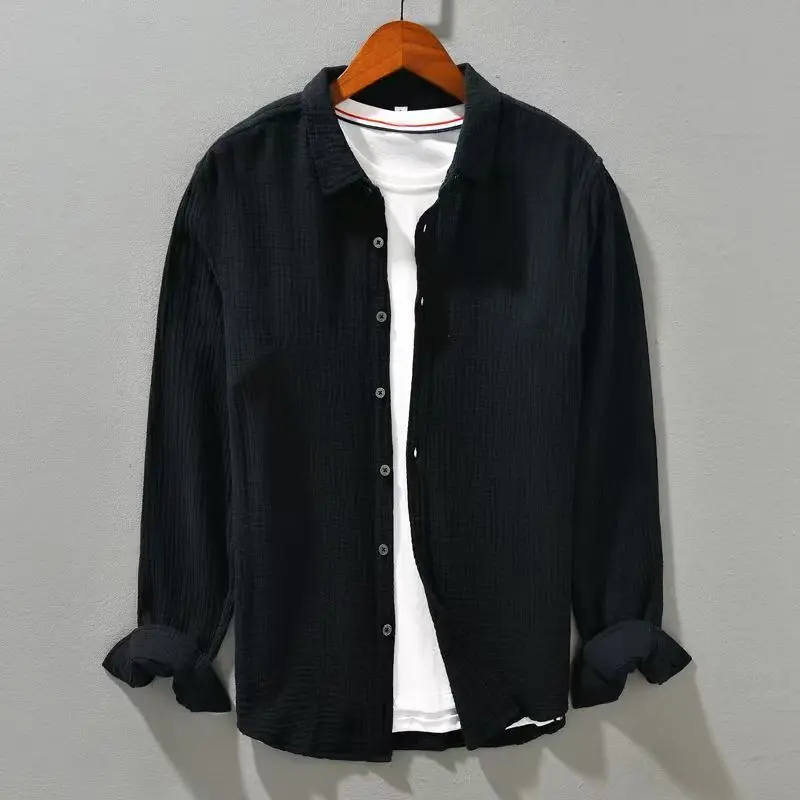 Lightweight men's casual button-up shirt with short sleeves, great for warm weather.