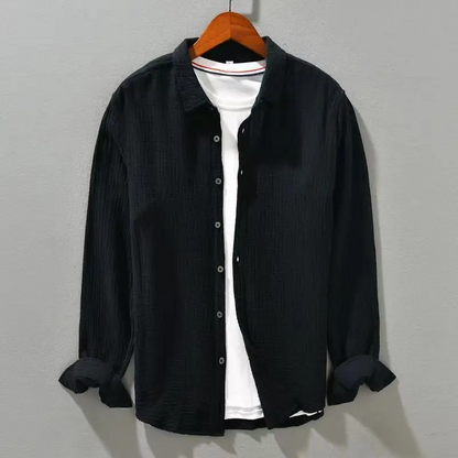 Lightweight men's casual button-up shirt with short sleeves, great for warm weather.