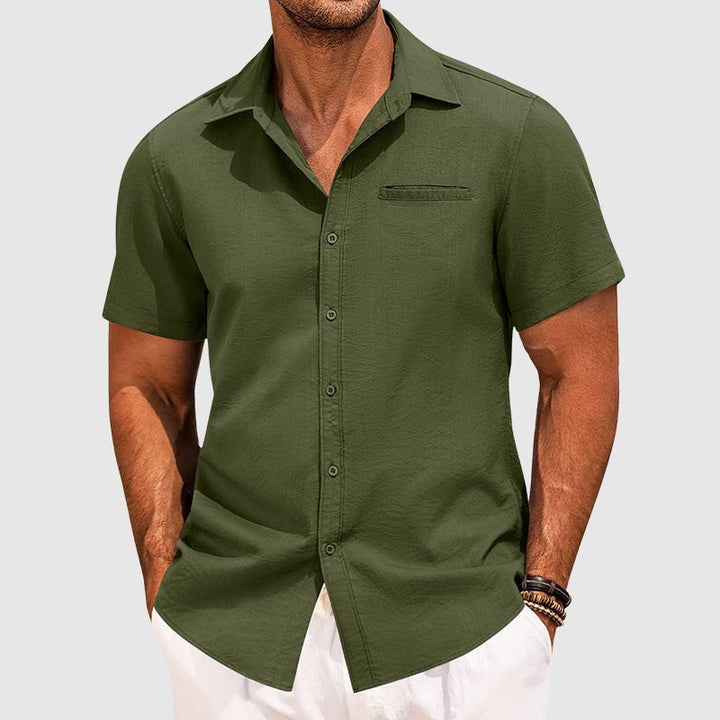 Men's lightweight button-down summer shirt with short sleeves, lapel collar, and chest pocket for casual warm weather.
